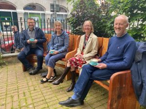 Councillors in Totnes enjoying the new bench installed as part of a project tackling loneliness