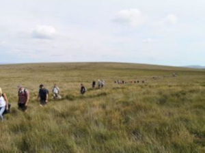 A group of walkers beating the bounds on Dartmoor